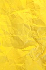 Crumpled yellow paper background
