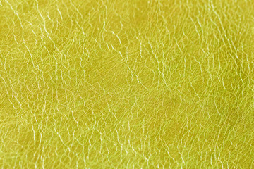 Texture of genuine khaki leather close-up. For modern pattern, wallpaper or banner design. With place for your text