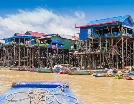 Colorful boats and stilt houses in Kampong Phluk floating village, Tonle Sap lake, Siem Reap Province, Cambodia

