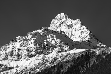 Black and white picture of snowy mountain peak