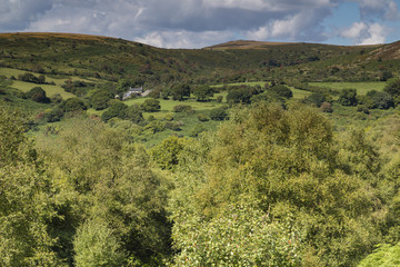 Farmhouse On Dartmoor / An image of a farmhouse sitting in the hills of Dartmoor, Devon, England, UK.