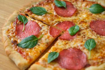 pizza with pepperoni and basil