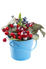 Flowerpot decoration with natural green plant and flowers and artificial mushrooms isolated