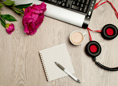 coffee computer and headphones on the desktop. Listen to music and relax. Wish a good day
