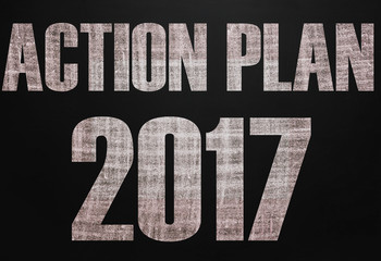 Black chalk board with the text Action plan 2017