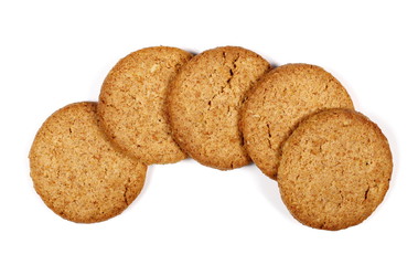 set round wholewheat biscuits with hazelnut isolated on white background