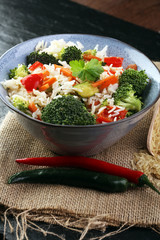 Colorful rice and vegetable salad - fresh mixed colorful healthy