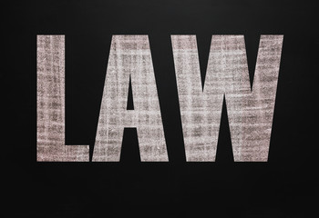 Black chalk board with the text Law