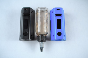 Electronic cigarette mod and a jar with fluid. ENDS. Top view.