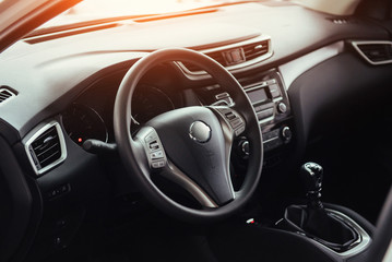 Obraz premium Modern car interior dashboard and steering wheel