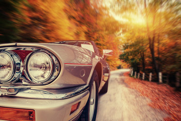 Fantastic asphalt road in the mountains. Classic car