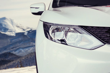 The headlights and the hood of a sports car