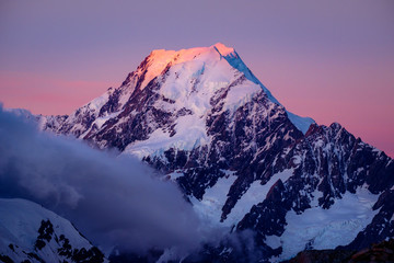Scenic view of Mt Cook summit at colorful sunset, NZ