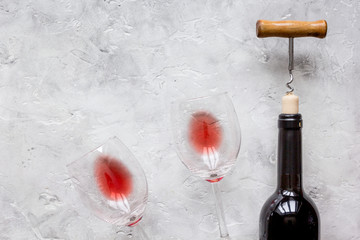 Glass of red wine and bottle on white background
