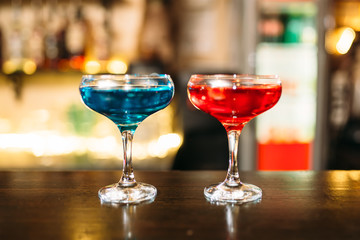 Cocktails on wooden bar counter closeup