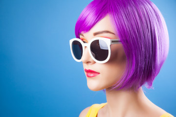 Fototapeta premium beautiful woman wearing colorful wig