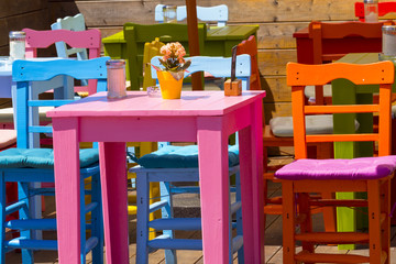 Colourful tables and chairs in a cafe on the harbor, Lindau, Bavaria, Germany, Europe