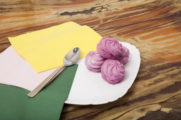  Beautiful composition of a pink zephyr on a wooden background
