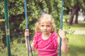 child in a swing