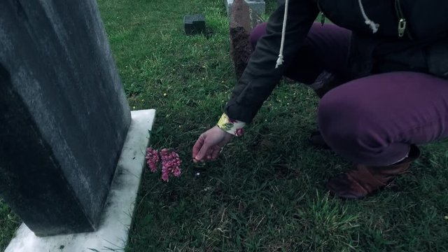 Visiting Headstone at Cemetery and Mourning or Remembering