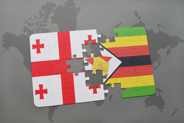 puzzle with the national flag of georgia and zimbabwe on a world map