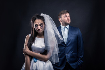 Tear-stained bride and brutal groom in suit