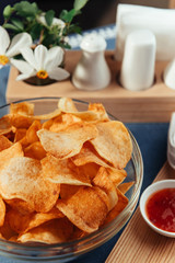 Potato chips with sauce on the table. Homemade sauces