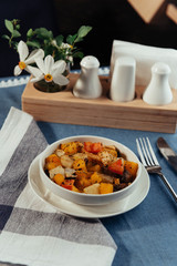 The cut fresh vegetables in a dish with spices