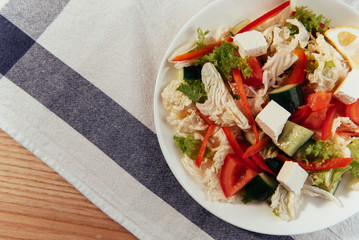 Greek salad with fresh vegetables, feta cheese and black olives