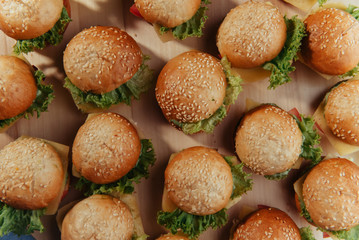 Hamburger on wood table. Home made burger. Fastfood meal