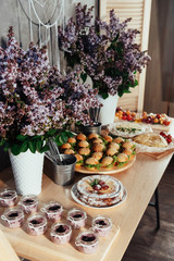 Canapes and drinks a desserts on the buffet table