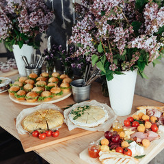 Canapes and drinks a desserts on the buffet table