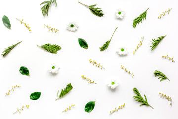 Froral pattern on white table background top view mockup