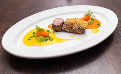 Steak of lamb with vegetable puree in the style yin yang