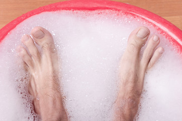 Fototapeta premium feet are bathed in soap