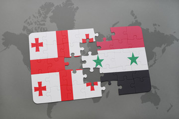 puzzle with the national flag of georgia and syria on a world map