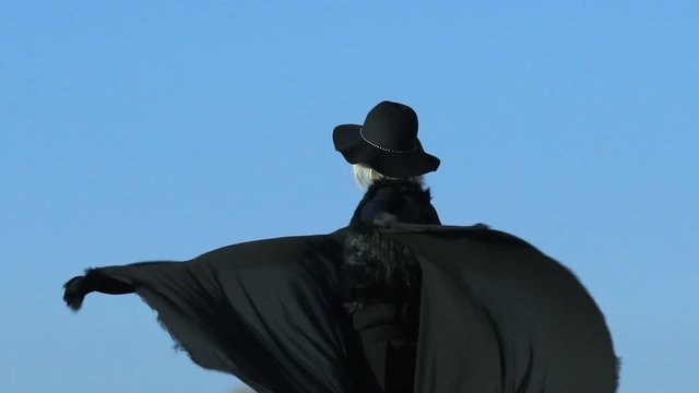 Beautiful dark lady dancing on the mountain
