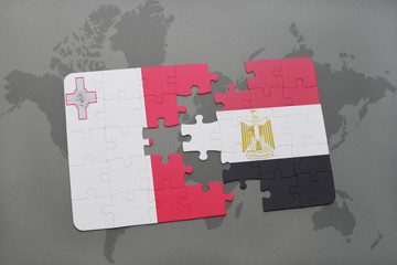 puzzle with the national flag of malta and egypt on a world map