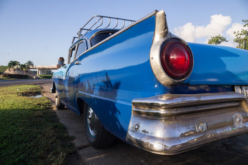 Blue oldtimer taxi rear view in Cuba