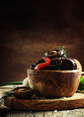 Marinated shiitake mushrooms, vintage wooden background, selective focus