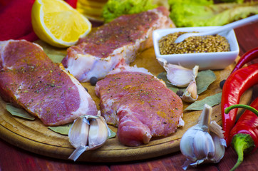 raw meat steaks with spices