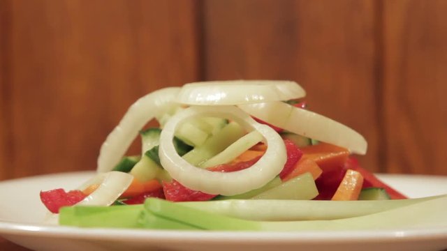 Healthy salad with fresh vegetables. Dietetic foods from environmentally friendly organic products. Vegetables from his garden. Slow rotate (1080p 25 fps; canon 7d, Sigma 24-70)