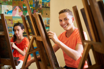 Education In Arts With Happy Student Smiling And Learning Art