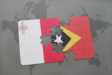 puzzle with the national flag of malta and east timor on a world map