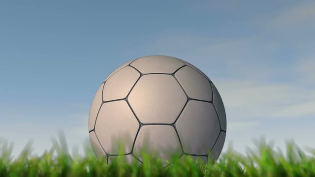  A static shallow depth of focus time lapse over a day of a soccer ball in the grass on a cloudy blue sky background - 3D render