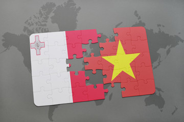 puzzle with the national flag of malta and vietnam on a world map