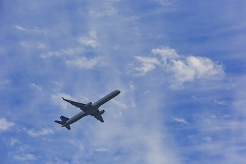 Fototapeta na wymiar Airplane flying in the sky