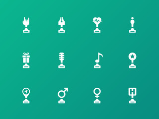 Sports trophies and awards icons on green background.