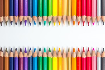 line of colored pencils with copy space. Colorful frame for text or artwork. 