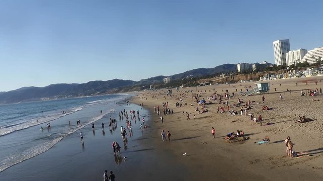 LOS ANGELES, CALIFORNIA, UNITED STATES OF AMERICA, NOVEMBER 5 Santa Monica beach full of people, at a evening, in California, United states of america